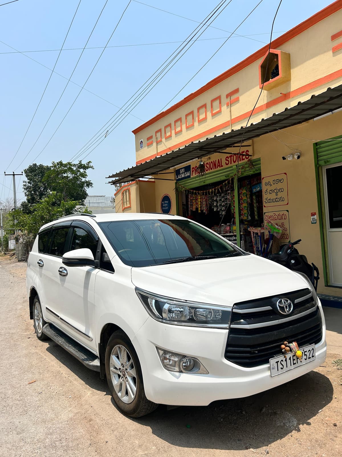 A photo of a Toyota Innova Crysta 2023 - Gray MUV.