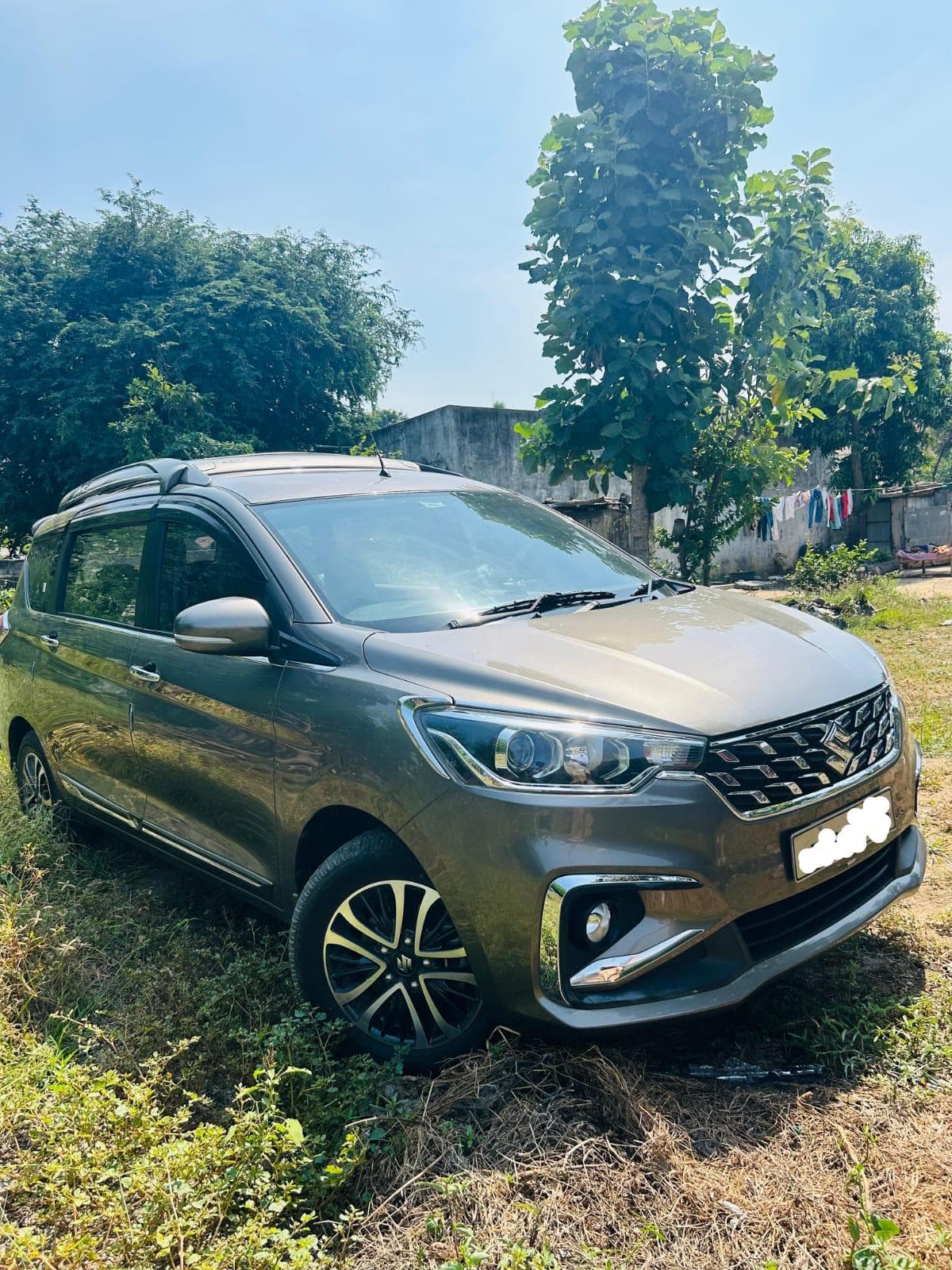 A photo of a Maruti Ertiga CNG ZXI 2025 - Olive MUV.